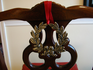 Silver Wreath Christmas Ornament on Chair Back by Classic Legacy