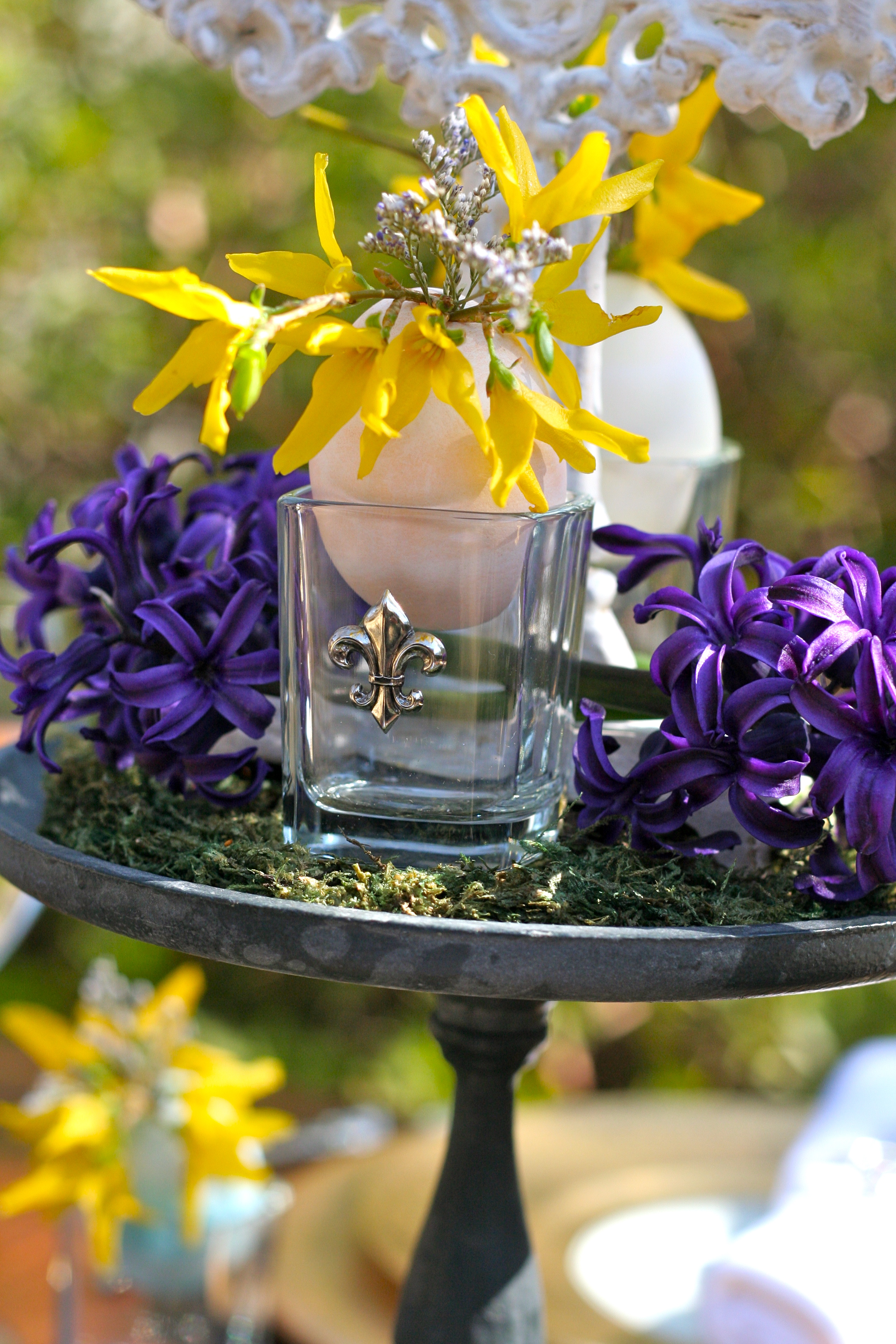 flower displays create interest in fleur de lis shot glass