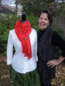 The Mannequin Evergreen Tree Skirt combines the Red Scarf, Classic Legacy Necklace , White blouse and evergreen skirt on Mannequin