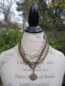 The Mannequin Evergreen Tree Skirt is decked out with Classic Legacy Jewelry.