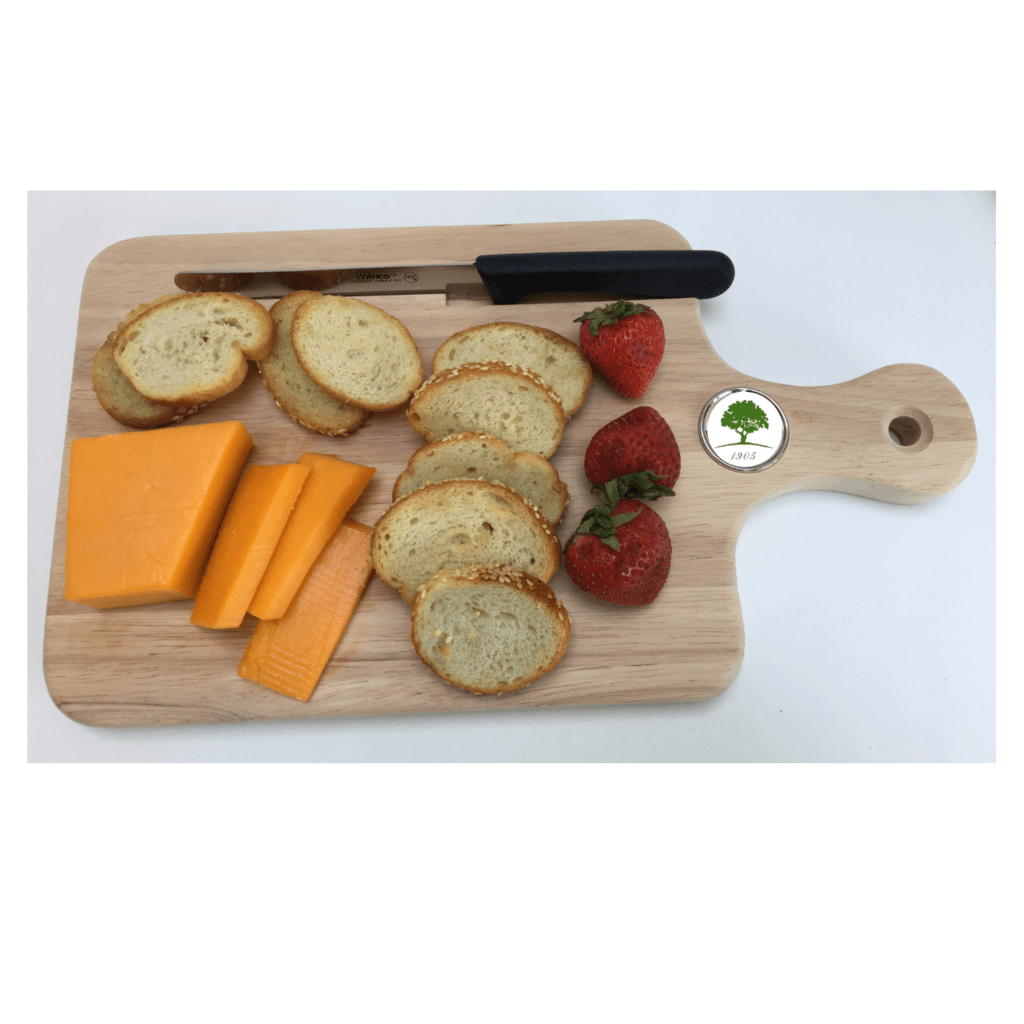 Wooden cheese board with country club logo