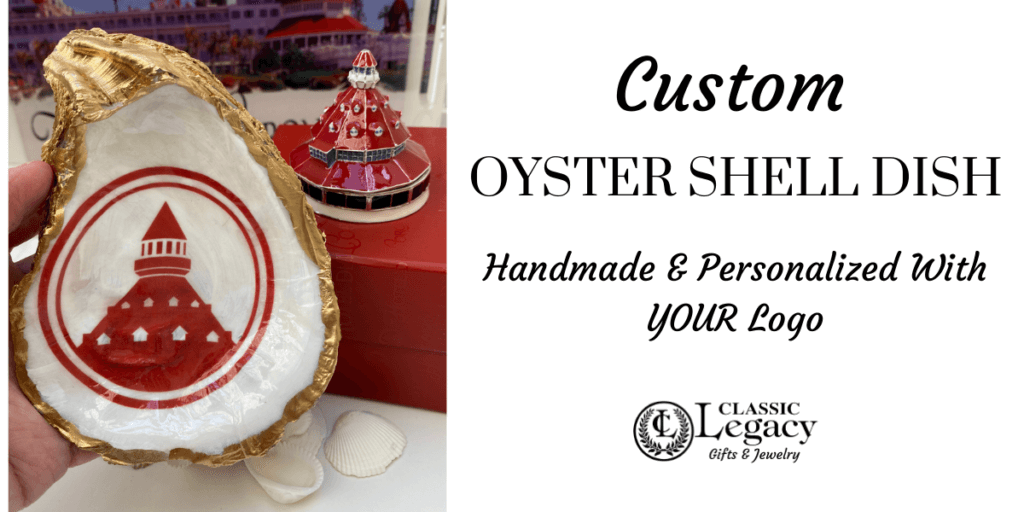 Oyster Shell Jewelry Dish embellished with custom logo.   The Hotel Del logo is shown and the dish has gold leaf edges. 