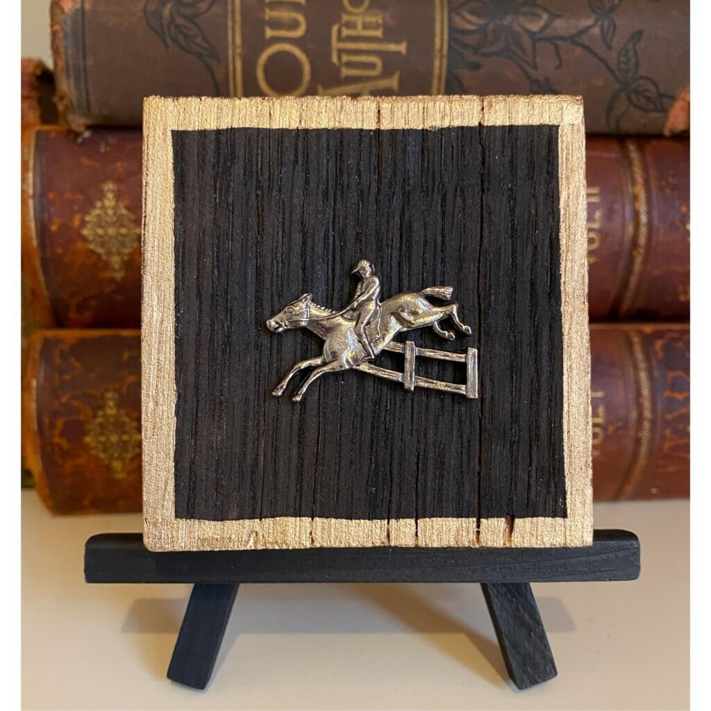 Bourbon Barrel wooden art featuring a silver horse jumper.  It measures 3" x 3". 